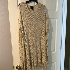 Elegant Cream Knit Poncho with Fringe